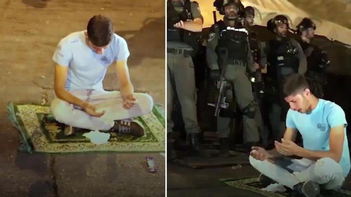 Filistinli müslüman genç, İsrail polisinin ortasında seccade üzerinde namaz yalvardı: Allah'ım yardım et
