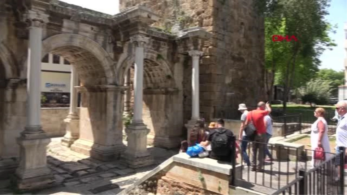 Antalya's historic Hadrianus Gate covered in weeds